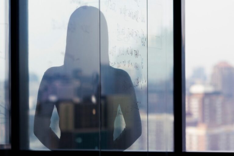 Woman looking out window
