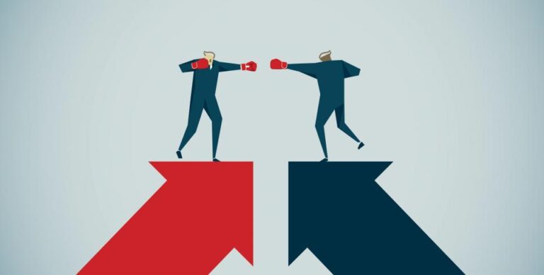 Two businessmen boxing