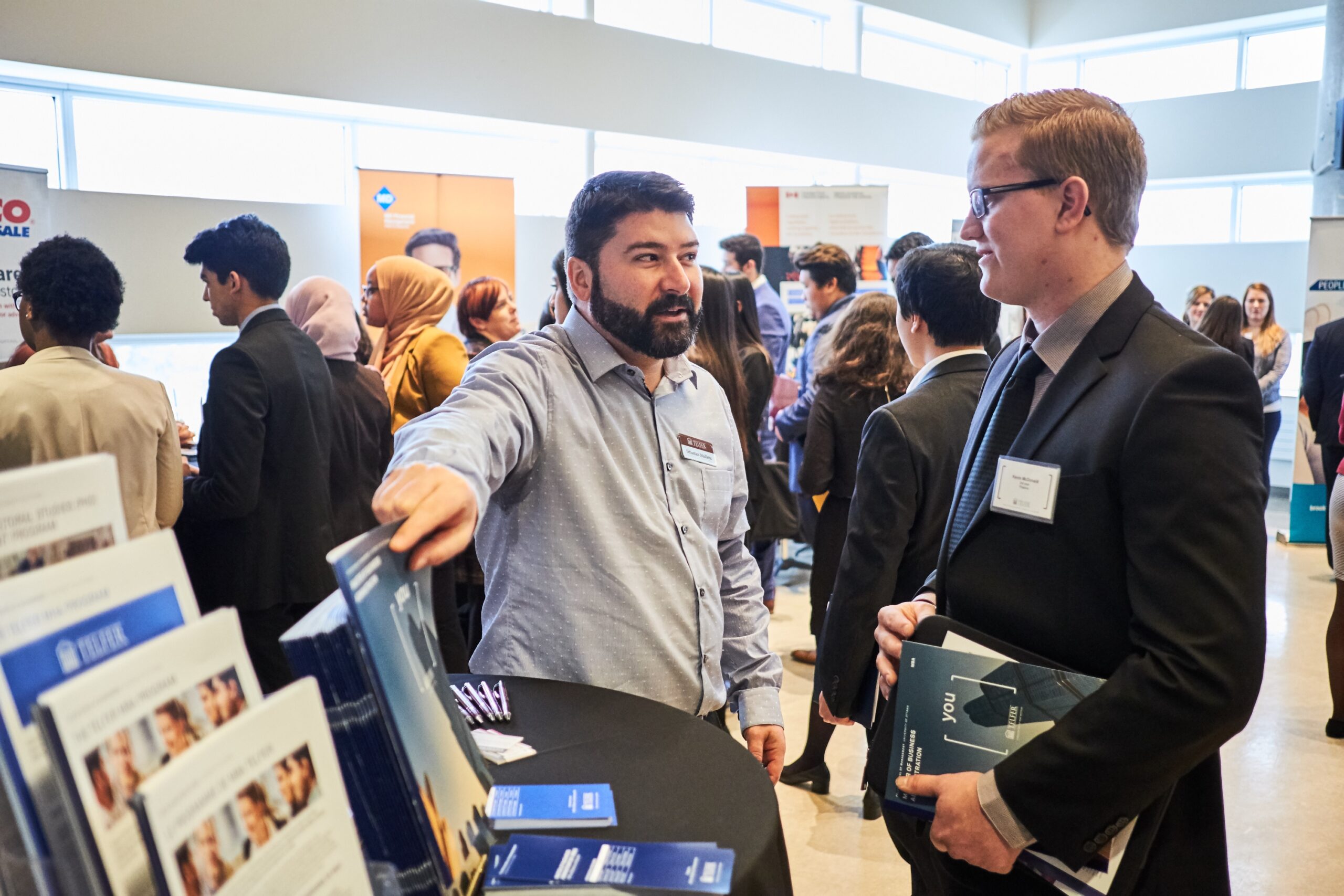 An employer speaks to an interested student