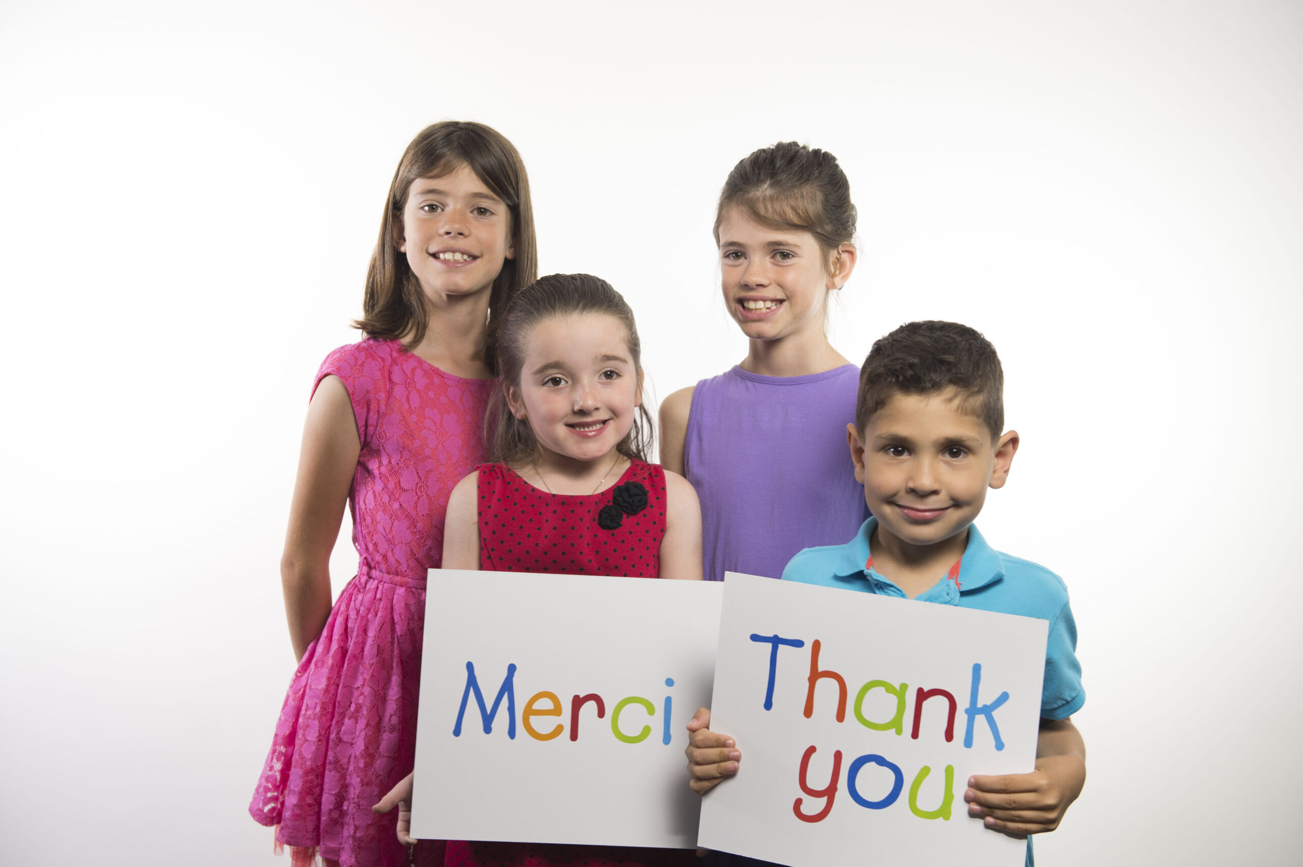 Children with thank you signs
