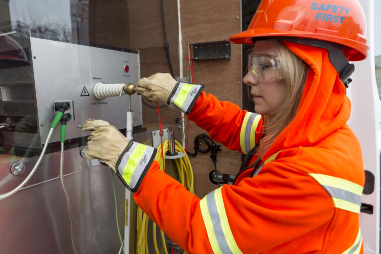 A hydro tech servicing a box