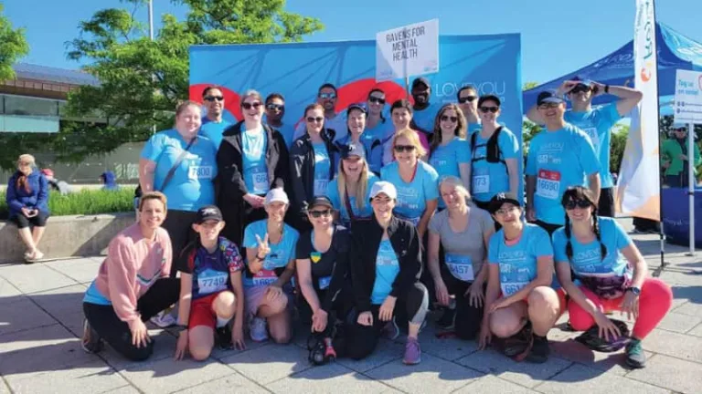 a group of colleagues pose for a pohto