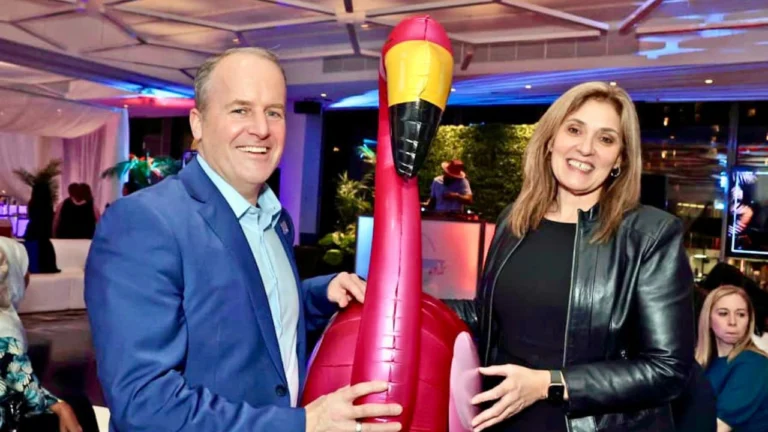 Cameron Love and Suzanne Madore pose with an inflatable flamingo at the Miami-themed The Night Shift: Lighting Up the Night for Nurses.