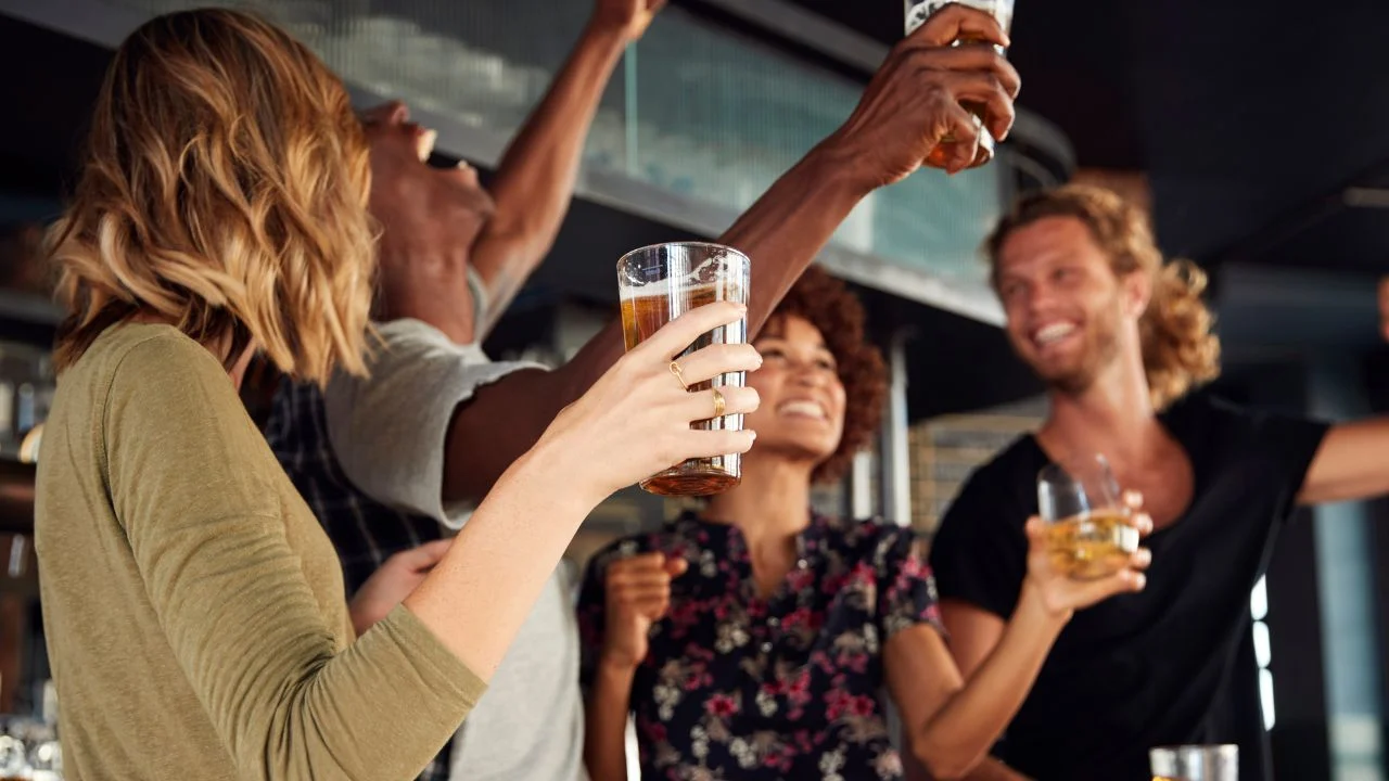 fans cheering in sports bar