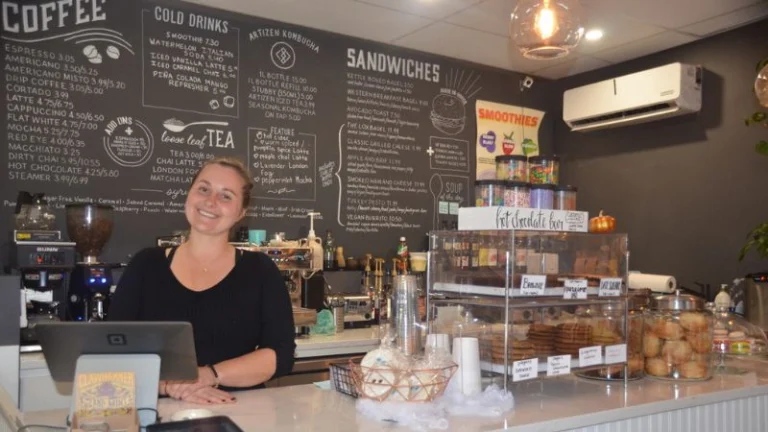 Dasha Smolentseva behind the cash register at North Folk Cafe