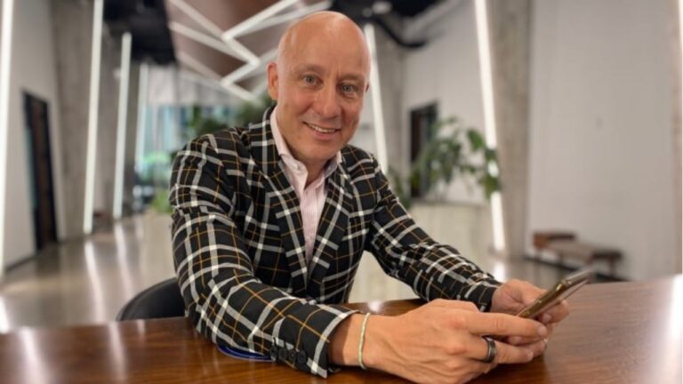 portrait of a man in a plaid blazer