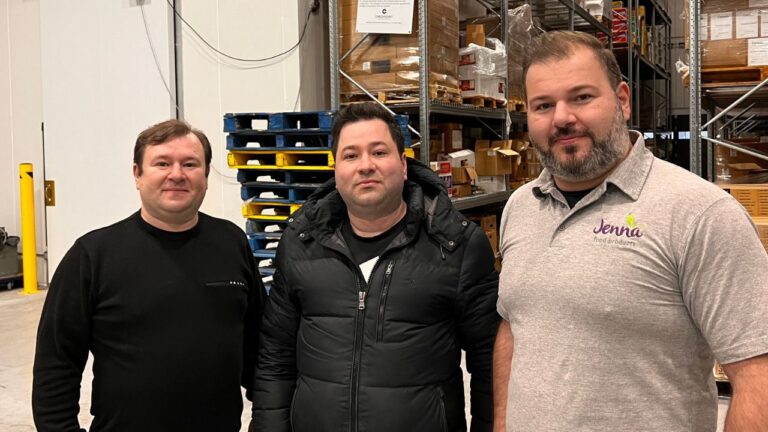three men in Jenna Food Products warehouse