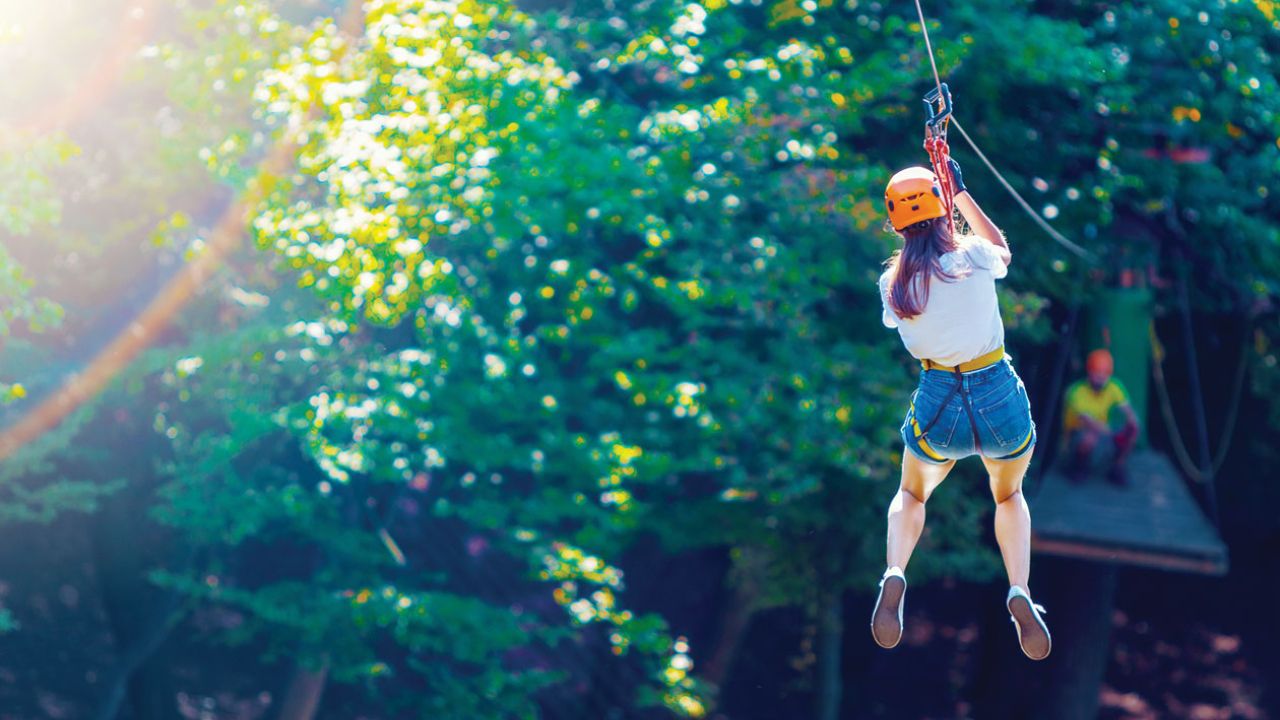 a woman ziplining