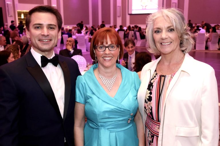 Three individuals attending the Spark Soirée in support of OBFE's School Breakfast Program