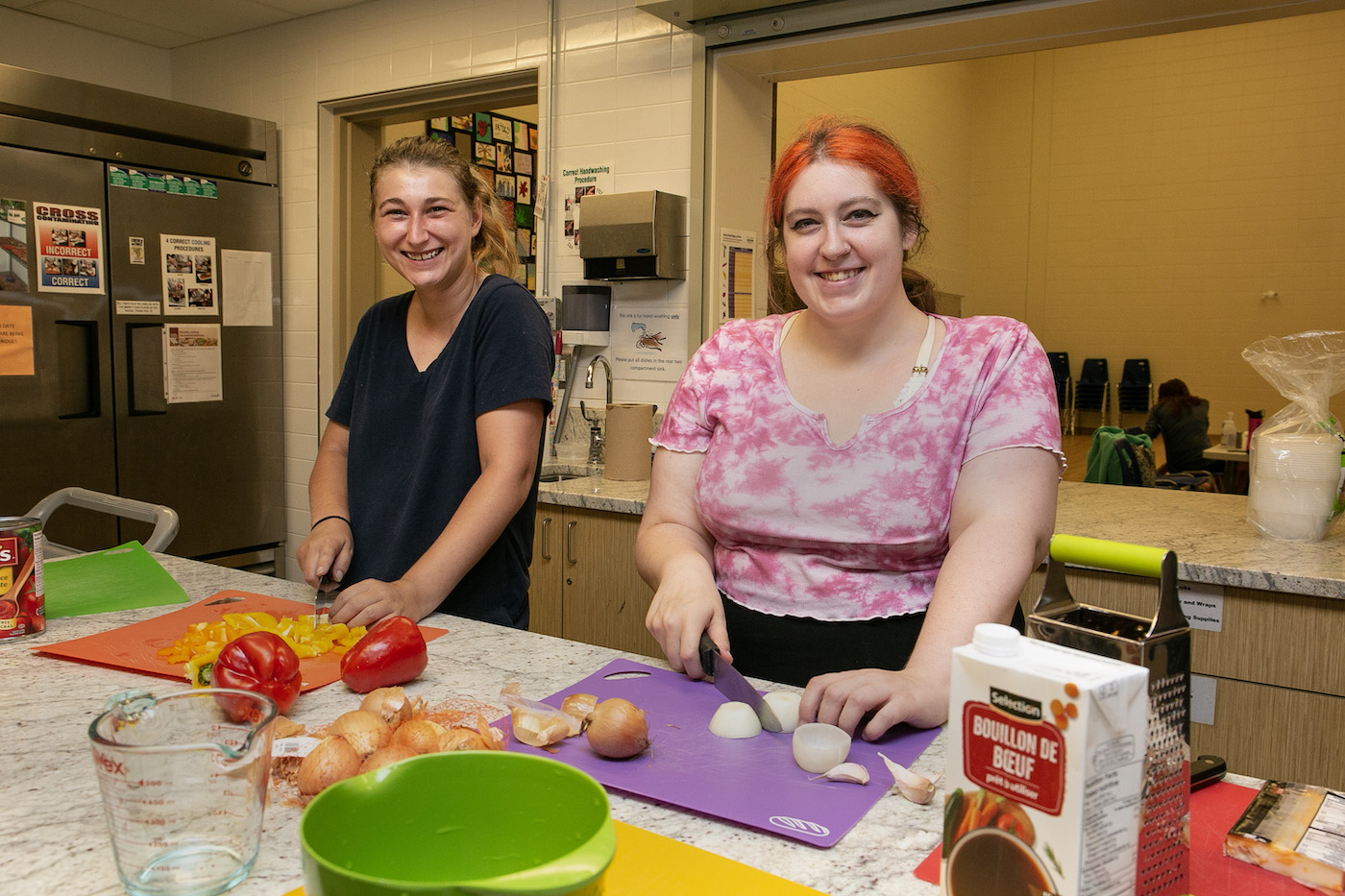 Girls preparing food at the Salvation Army