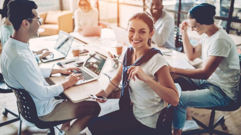 Young group showing 'peopling' in the office
