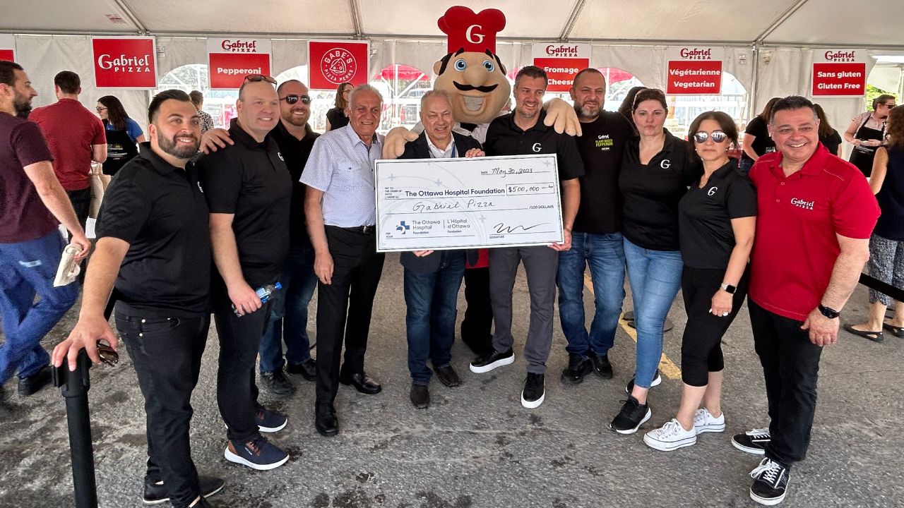 Gabriel Pizza donating to the Ottawa Hospital