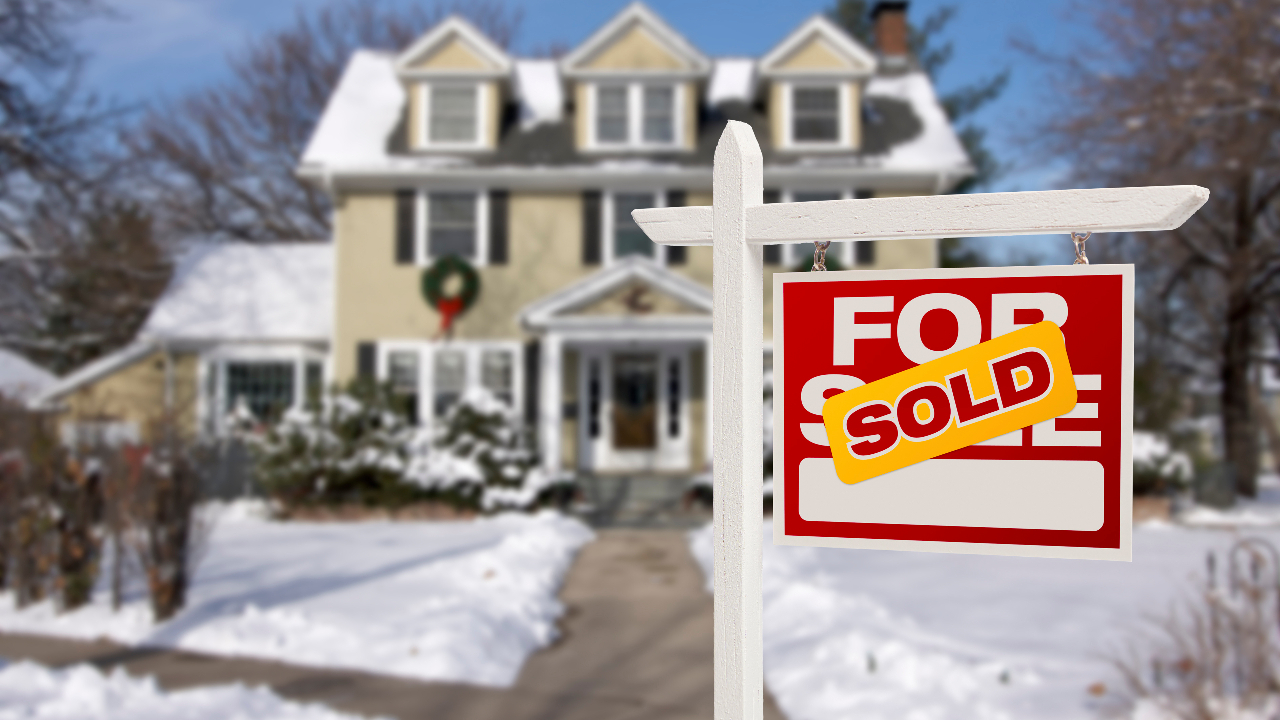 Winter home sold stock image