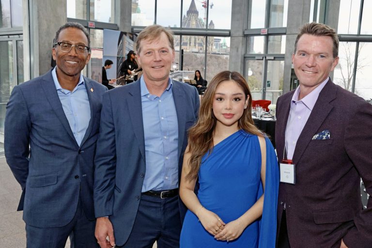 From left, Stéphane Brutus, dean of the Telfer School of Management at the University of Ottawa, joined by keynote speaker and Windmill Development Group founder and CEO Jonathan Westeinde, Carolina Rodriguez, president of Telfer's student-run Entrepreneurs' Club, and Telfer alumnus and Invest Ottawa executive Nick Quain. Photo by Caroline Phillips