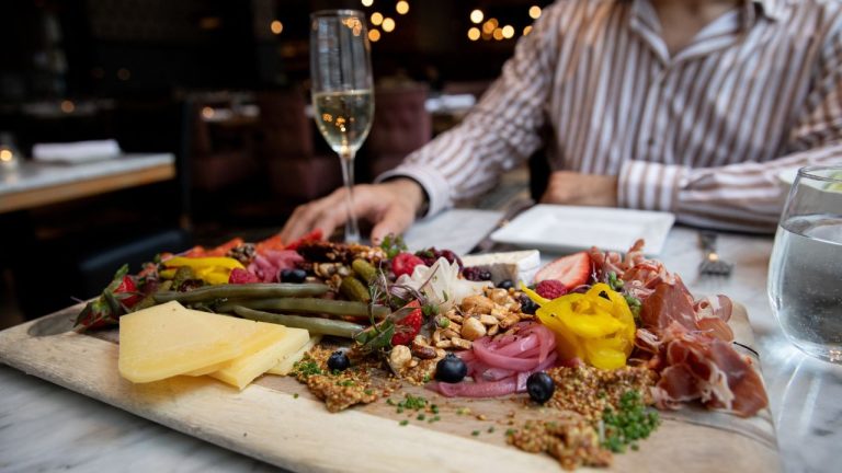 Charcuterie and sparkling wine for happy hour at Social. Photo by Yvonne Langen