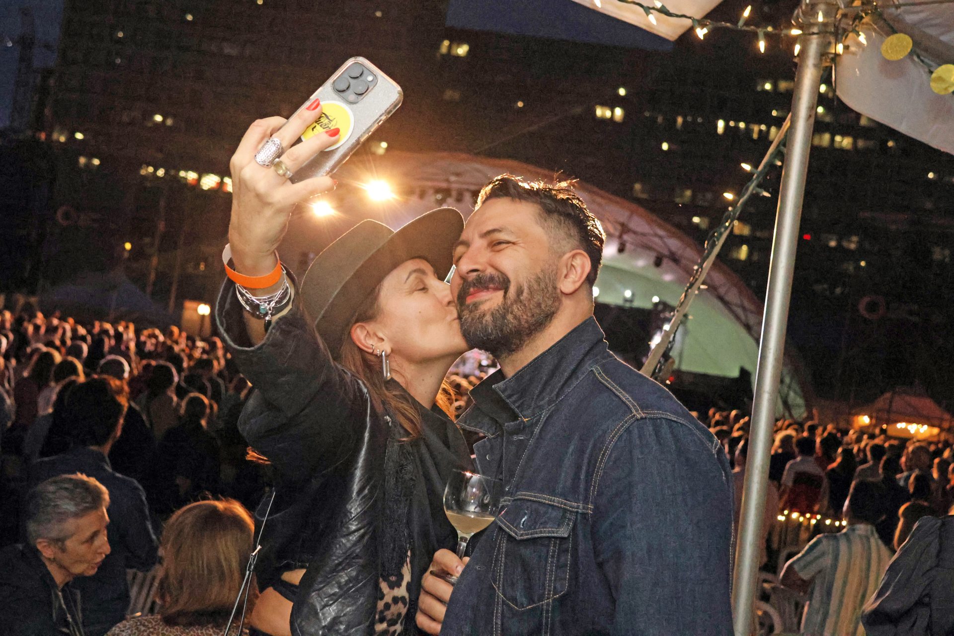 Claudia Balladelli, program director at Axé WorldFest, and Philippe Lafreniere in the VIP area in Confederation Park for the opening night of Ottawa Jazz Festival on Friday, June 21, 2024. Photo by Caroline Phillips