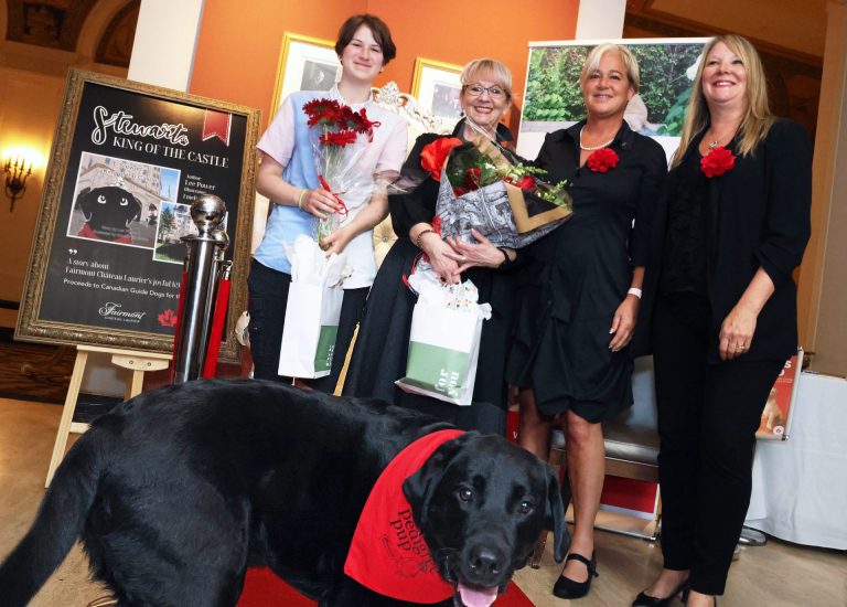 Canine ambassador Stewart (front) is the focus of a new children's book, launched Friday, June 28, 2024, at the Fairmont Château Laurier with, from left, illustrator Emelia Vincelette, hotel employee and author Lee Power, Fairmont Château Laurier general manager Geneviève Dumas and director of sales and marketing Lori Wagner. Photo by Caroline Phillips