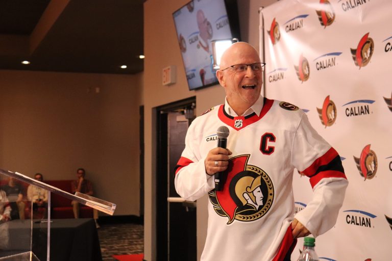 Calian CEO Kevin Ford dons the new Ottawa featuring his company's logo. Photo by Mia Jensen