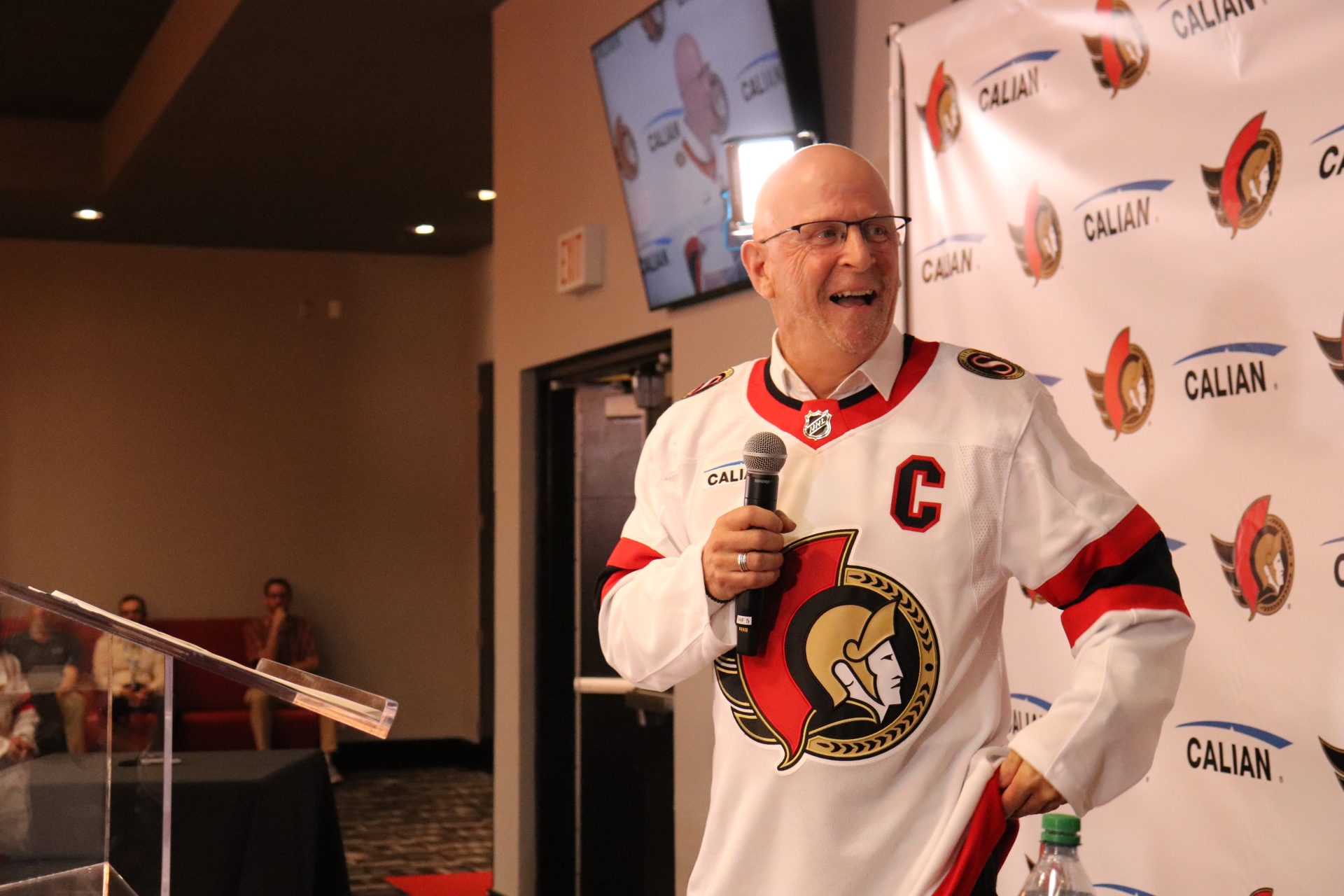 Calian CEO Kevin Ford dons the new Ottawa featuring his company's logo. Photo by Mia Jensen