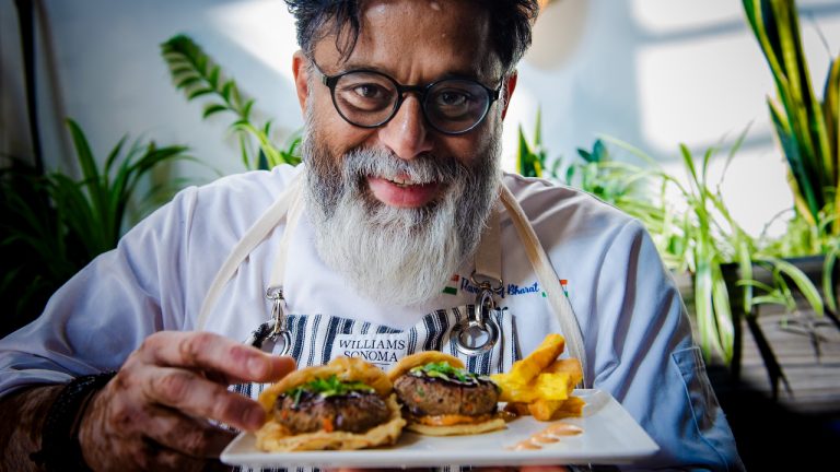 Chef Joe Thottungal showing off his Novemburger creation in support of the United Way East Ontario. Photo provided by United Way East Ontario.
