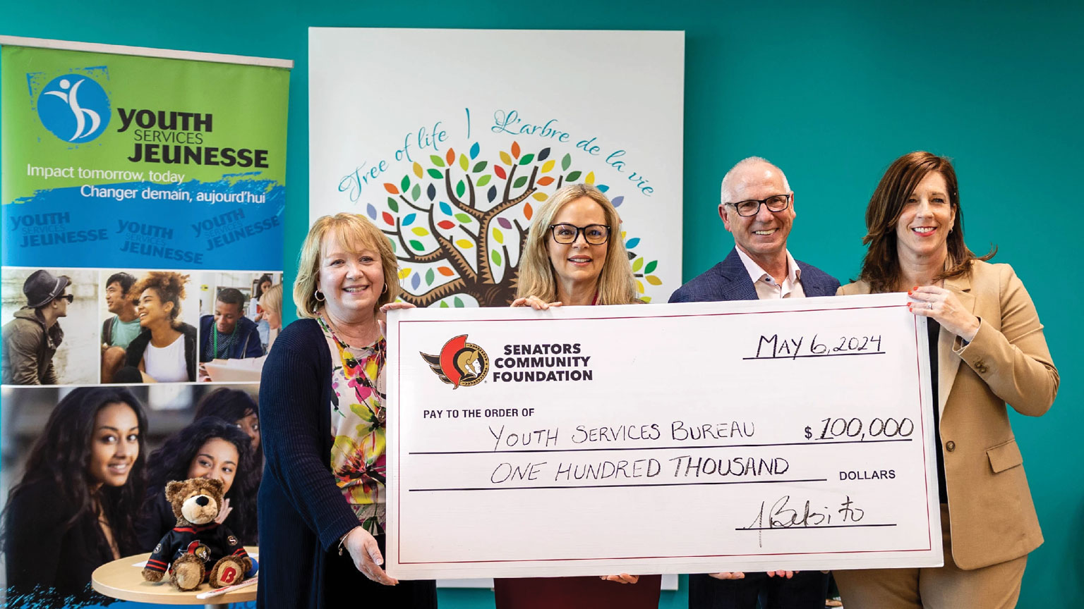 Youth Services Bureau staff accept a donation