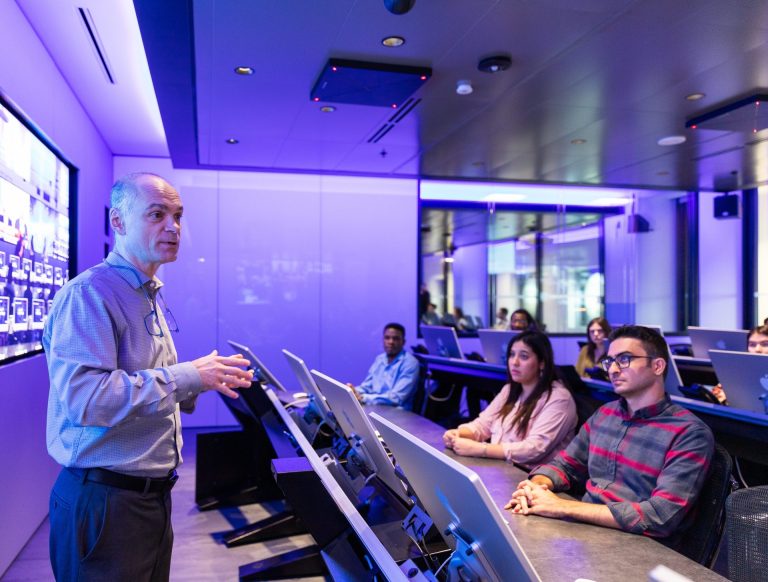Dr. Guy-Vincent Jourdan (first from left) with participants during a simulation at the uOttawa-IBM Cyber Range
