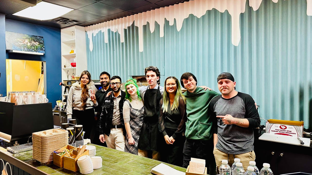 EveryPerson Cafe staff at their launch event on Jan. 22. Left to right: Tasha (barista), Daniyal (Co-Owner), Mohannad (Co-Owner), Violet (Barista), Val (General Manager), Michelle (Barista), Gavriel (Barista), Gabe @indoartamus (community artist). Photo provided.