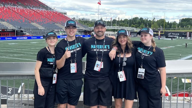 Maverick's Donuts franchisees Jon Martin and Liz Ellwood with their children. Left to right: Lauren Martin, Jack Martin, Jon Martin, Liz Ellwood, Anna Becksted. Photo provided by Liz Ellwood.