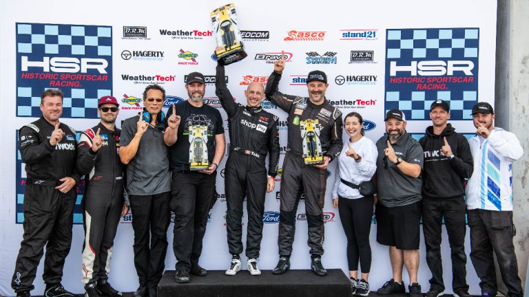 TwoTh Autosport team as drivers Tobi Lütke and Travis Hill win the HSR prototype challenge in 2024. From left to right: Barry DeGray (Fuel/Transport), Kenny Riedmann (Driver), Rowan Smillie (Lead Engineer), Adam Tierney (Lead Technician/Shop Foreman), Tobias Lutke (CEO, Shopify), Travis Hill (Team Principal/Driver), Nadine Audette (Hospitality), Trevor Hill (Team Principal/Competition Director/Driver), Marc Warren (Technician), Cameron Keighley (Media). Photo provided by TwoTh Autosport.