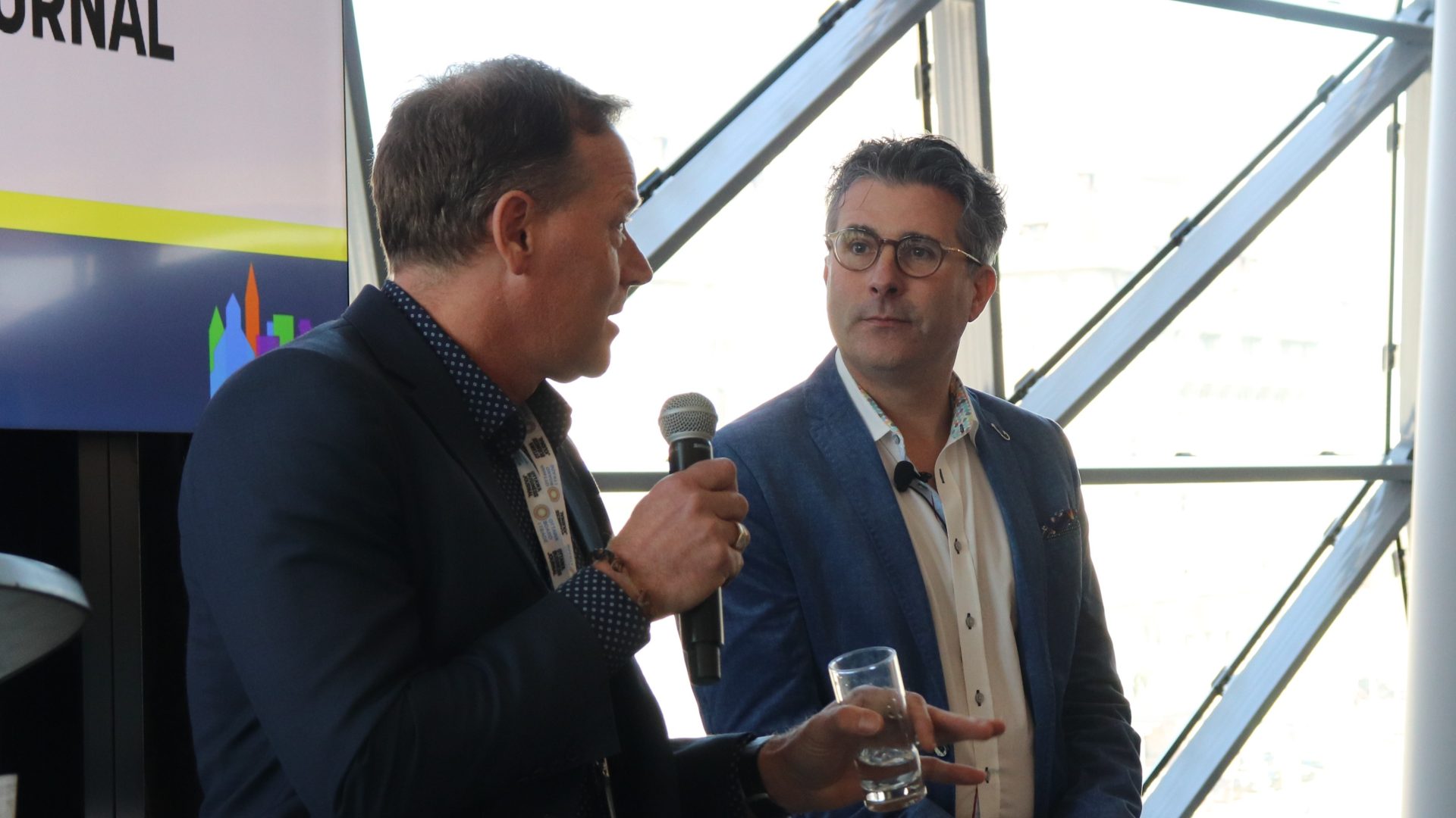 Windmill Development Group's Jonathan Westeinde (left) and Linebox Studio's Andrew Reeves at the City Building Summit on Wednesday. Photo by Mia Jensen