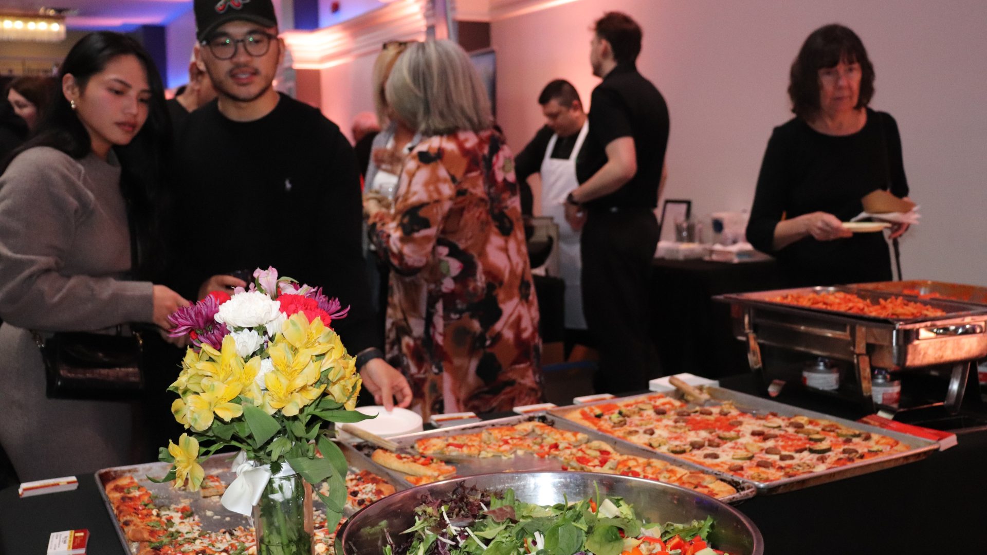 Guests peruse offerings from La Favorita and Seta's Kitchen and Charcuterie at Taste of Little Italy on Tuesday at the Preston Event Centre. Photo by Mia Jensen