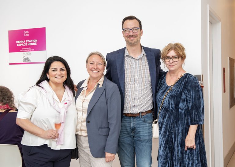 Alik Angaladian, MP Mona Fortier, and Stephen Beckta, president of the Beckta Restaurant Group, and guest at the Ottawa Art Gallery Paint the Town Pink art auction May 29, 2025 at the OAG. Photo by Tia MacPherson.