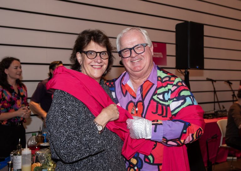 Sheila Whyte, president and owner of Thyme & Again Creative Catering and Take Home Food Shop, and Joseph Cull, emcee and chair at Cornerstone Purple Tie Gala, at the Ottawa Art Gallery Paint the Town Pink art auction May 29, 2025 at the OAG. Photo by Tia MacPherson.