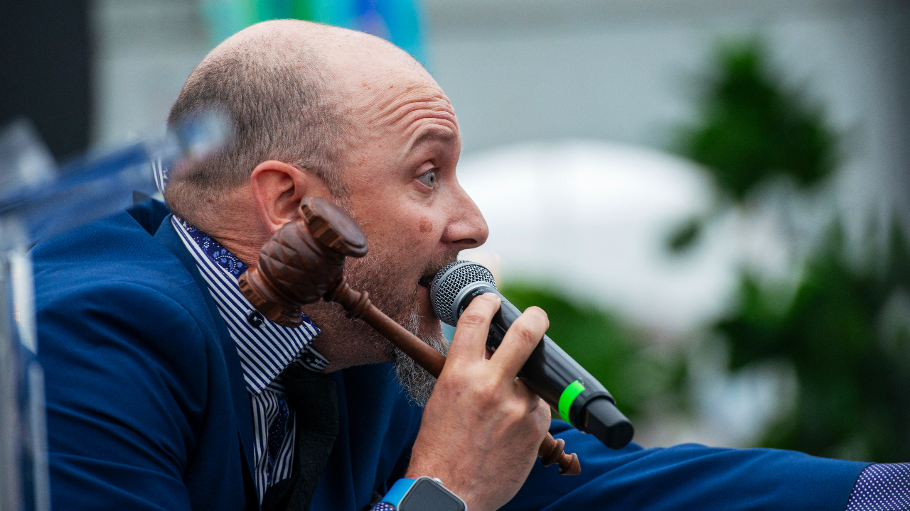 Auctioneer Ryan E. Watson at the Ottawa Riverkeeper Gala at Jacques-Cartier Park on May 21, 2025. Photo by Tia MacPherson.