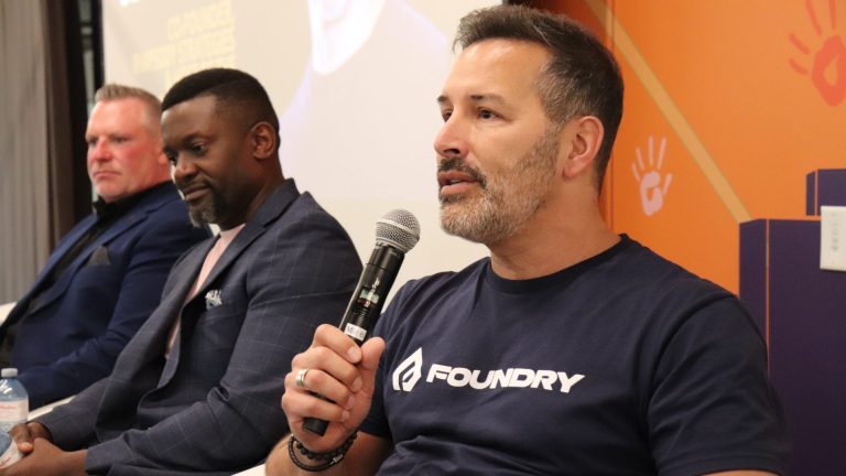 Eric Deschamps (right), co-founder of Rhapsody Strategies speaks at the Dare To Be Vulnerable Men's Mental Health Month session. Photo by Mia Jensen