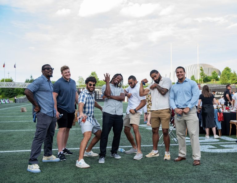 Ottawa Redblacks players pose for a photo before the sit-down dinner at Gourmet on the Gridiron, June 24, 2025. Photo by Tia MacPherson.