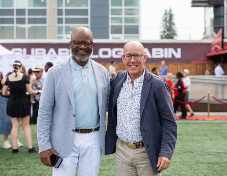 Mark Goudie, president and CEO of the Ottawa Sports and Entertainment Group, with Bob Dyce, head coach of the Ottawa Redblacks, at Gourmet on the Gridiron, June 24, 2025. Photo by Tia MacPherson.