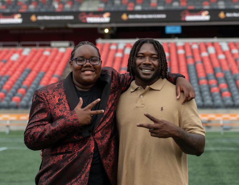 Ottawa Redblacks player James Peter and his mentee Daniel Moise from the Ottawa Redblacks Mentorship Program at Gourmet on the Gridiron, June 24, 2025. Photo by Tia MacPherson.