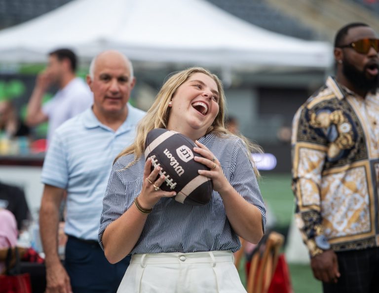 Practice throwing a football through the target with the Ottawa Redblacks at Gourmet on the Gridiron, June 24, 2025. Photo by Tia MacPherson.