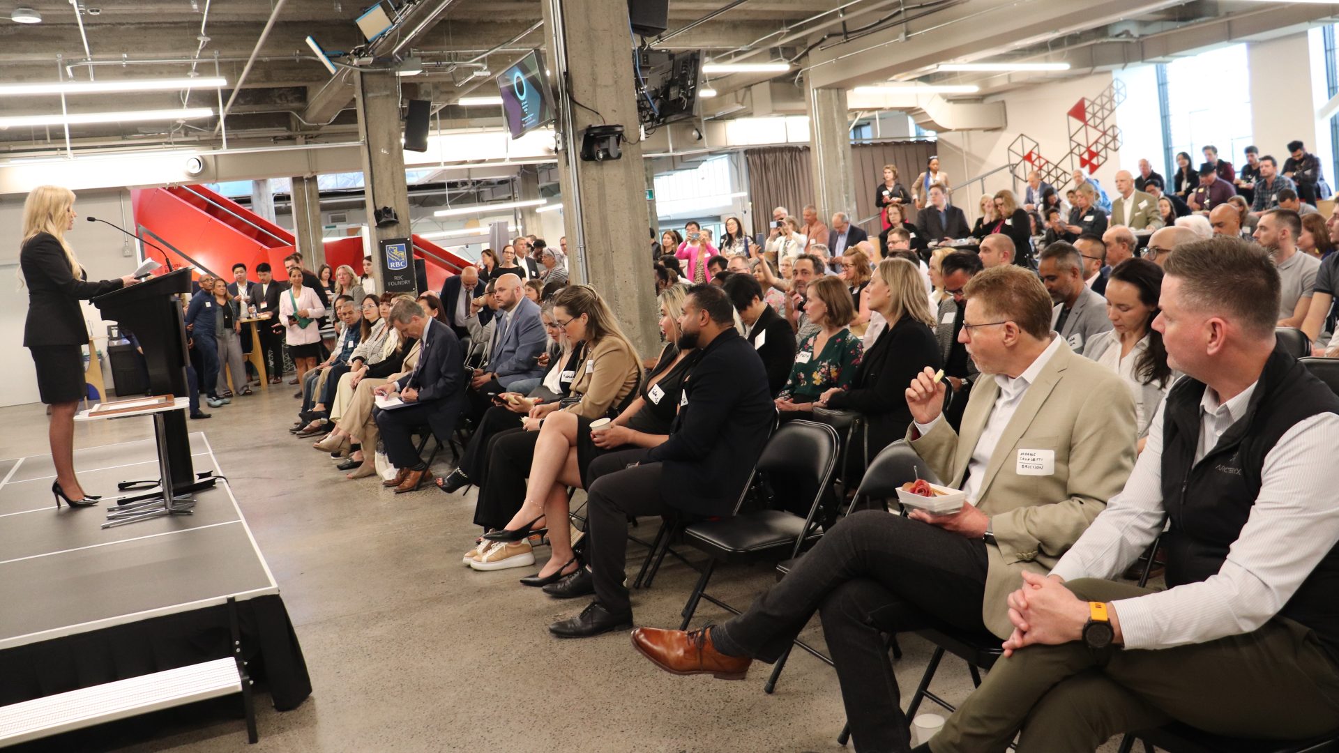 Invest Ottawa's Sonya Shorey speaks at the launch of Ottawa Innovation Week at Bayview Yards on Monday. Photo by Mia Jensen