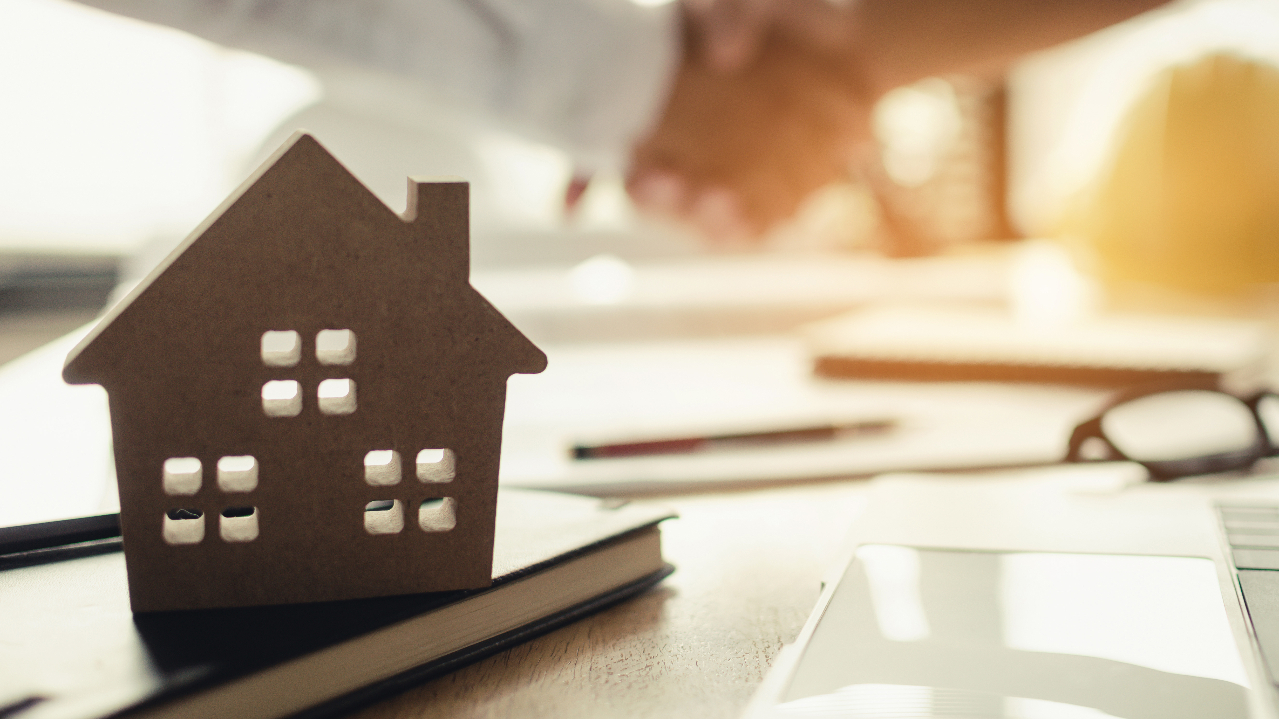 Home sale handshake stock image