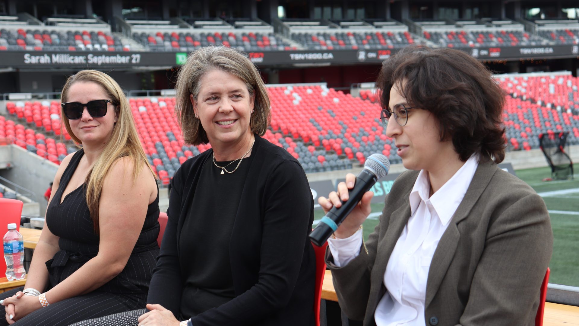 From left: Tiffani Westerman (Wesley Clover Services), Heidi Adams (Nokia) and Marwa Wazzi (CENGN) at the Op-HER-ations of Tech panel at TD Place on Thursday. Photo by Mia Jensen