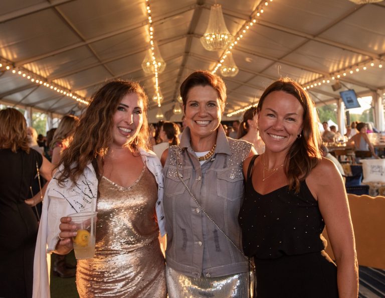 Mary Ciancibello catching up with co-chair Catherine McLaughlin and Lindsay Firestone, director community engagement and development at the University of Ottawa Heart Institute at Spurs & Sparkles for QCH Foundation at Wesley Clover Park, August 13, 2025. Photo by Tia MacPherson.