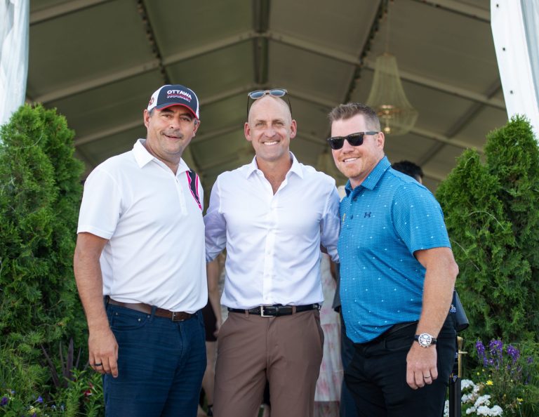 Chris Phillips of the Ottawa Senators, LoudCups Creator Jay Conohan and former Ottawa Senator Chris Neil at Spurs & Sparkles for QCH Foundation at Wesley Clover Park, August 13, 2025. Photo by Tia MacPherson.