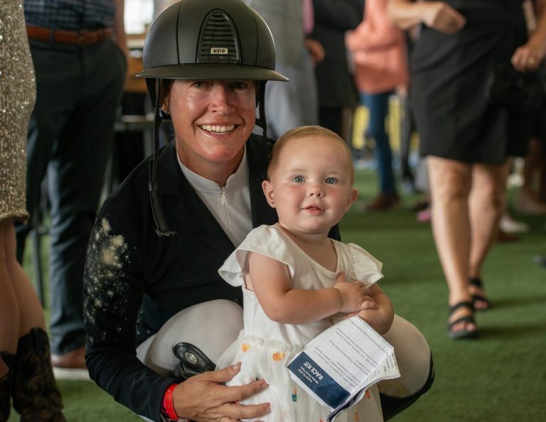 Team Cityscape rider Carly Campbell-Cooper, winner of the Buckeye Nutrition Grand Prix earlier this year, with daughter Eloise Jamieson at Spurs & Sparkles for QCH Foundation at Wesley Clover Park, August 13, 2025. Photo by Tia MacPherson.