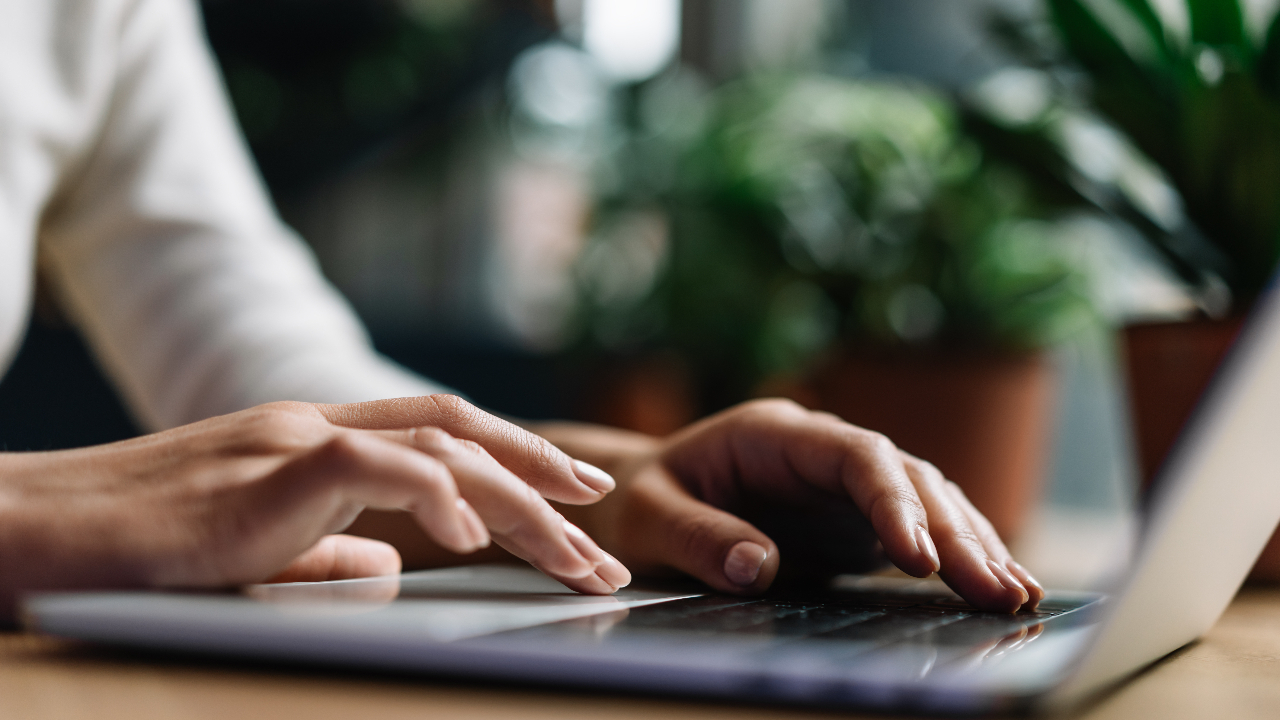 Person typing on laptop