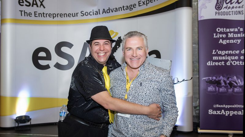 Founder of eSAX Jarrod Goldsmith with MC Dylan Black at eSAX (The Entrepreneur Social Advantage Experience)! at the Horticulture Building in Lansdowne Park, November 12th, 2025. Photo Tia MacPherson for OBJ.