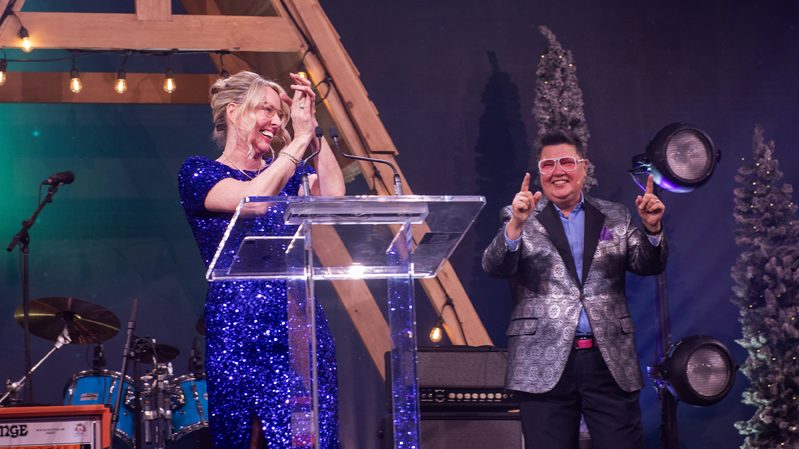 President and CEO of The Ottawa Cancer Foundation Deborah Lehmann and Layne the Auctionista celebrating as the donations keep coming in during the live auction at the Ottawa Cancer Foundation Aurora Ball, The Westin, November 23rd, 2025. Photo by Tia MacPherson for OBJ.