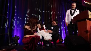A heartwarming moment on stage. Cece and her family alongside Steve Read, President & CEO, CHEO Foundation.