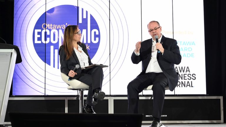 Kevin Reed, co-founder and chief operating officer of the Defence, Security and Resilience Bank, speaks to Sueling Ching, president and CEO of the Ottawa Board of Trade, at the Ottawa Economic Outlook event on Jan. 21, 2026. Photo by Mark Holleron.